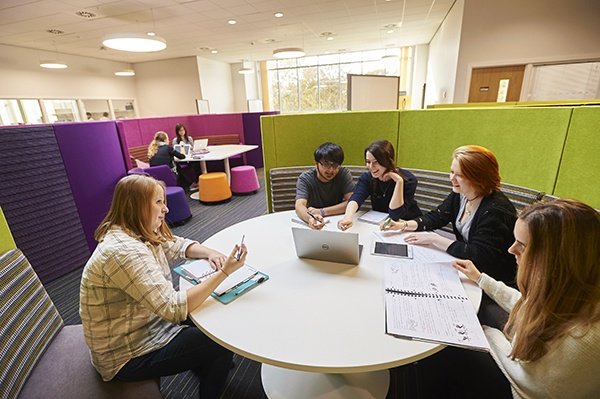 Students sitting round table